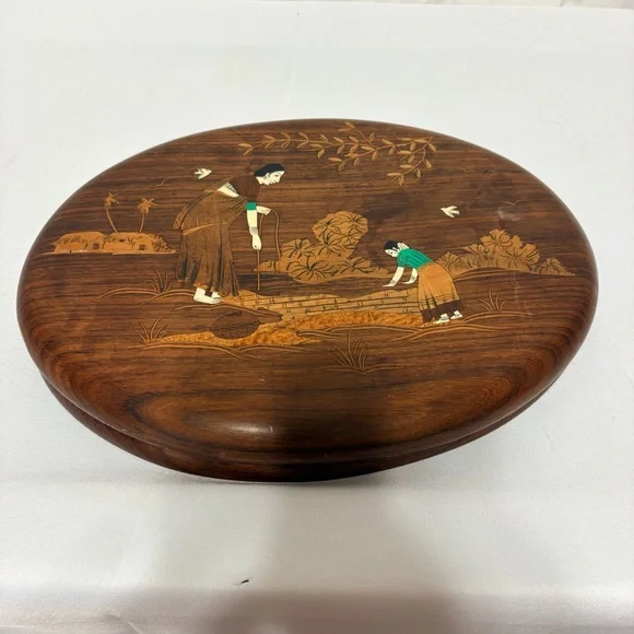 Vintage Indian rosewood wall art plaques with intricate bone inlay designs.